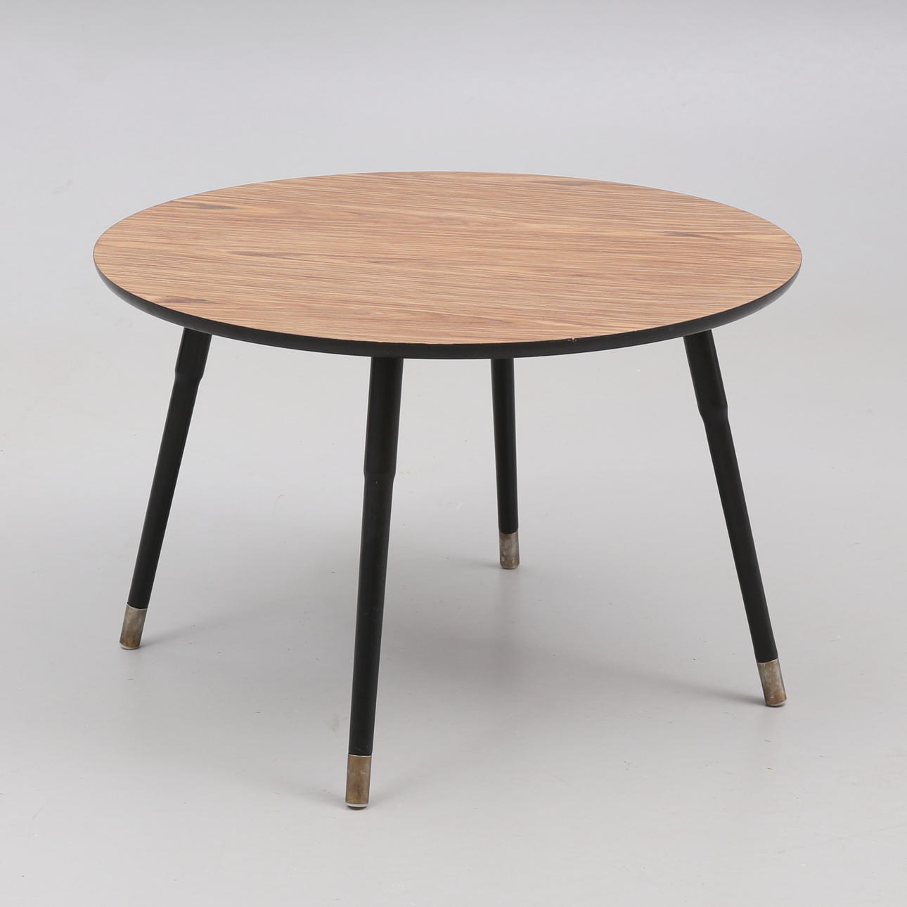 A round IKEA coffee table, 21st century.