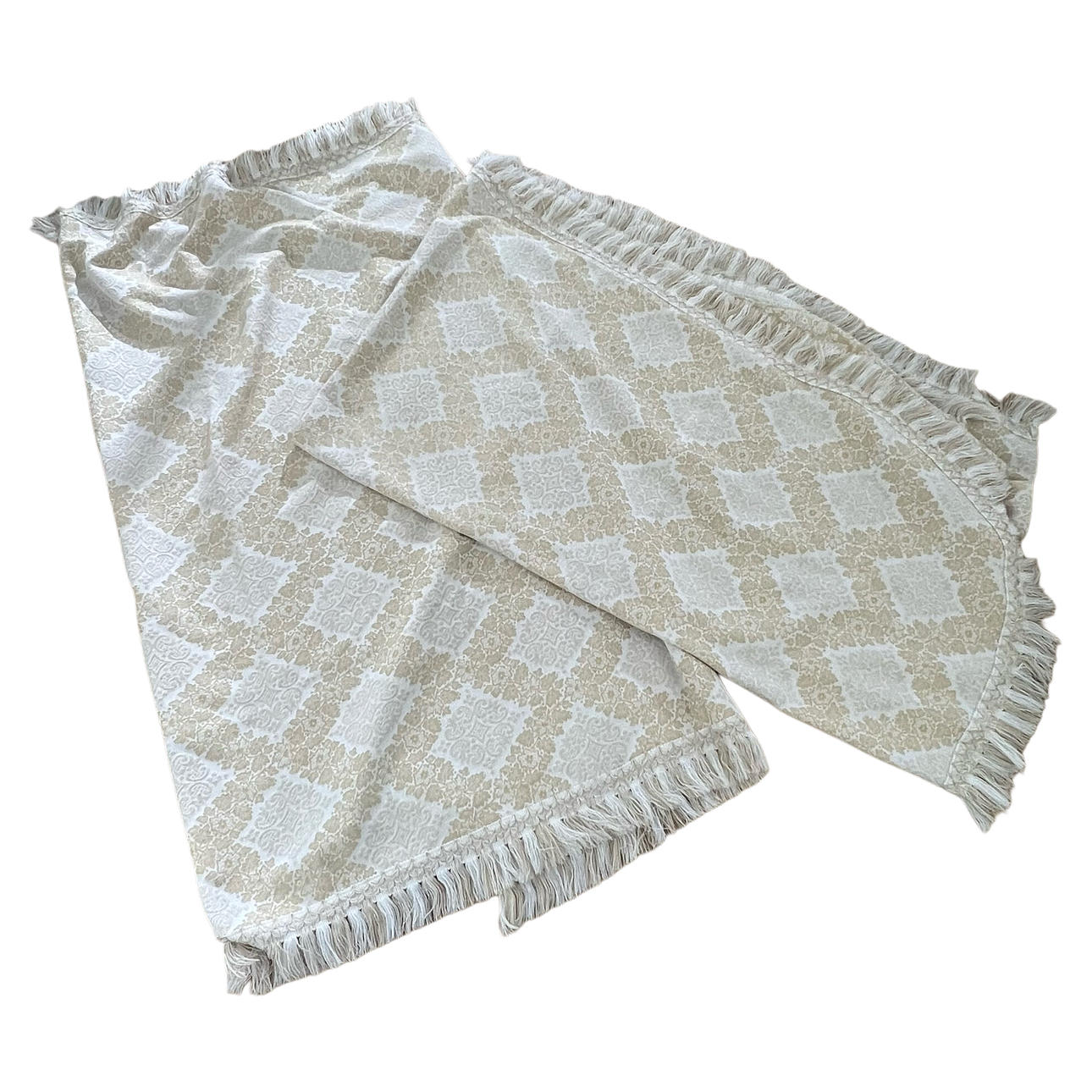 Pair of single bedspreads in damask fabric in shades of gold and beige with fringe.