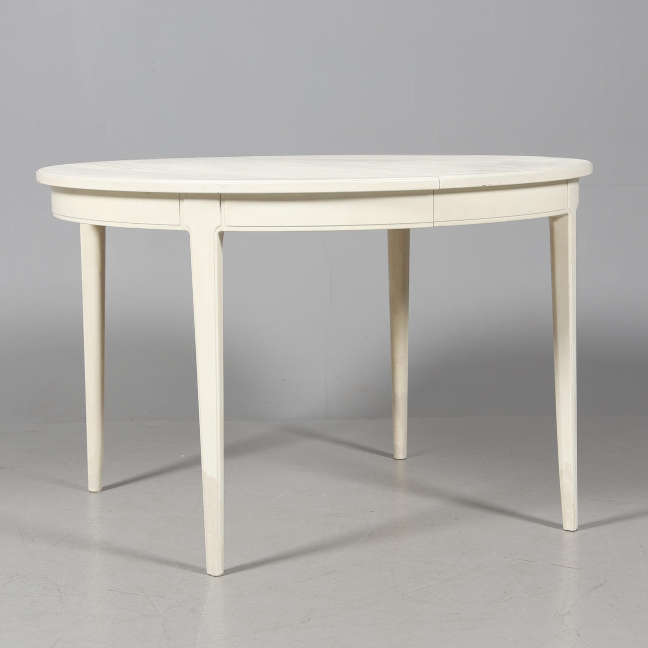 CARL MALMSTEN. DINING TABLE, “The Manor”, painted wood.