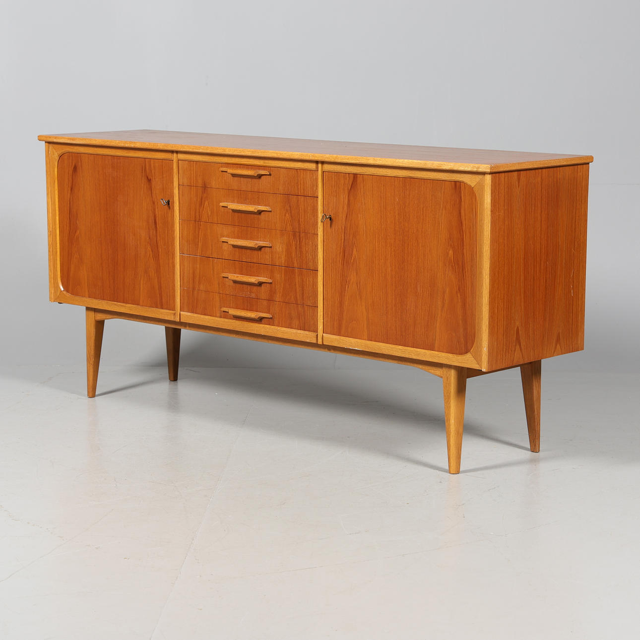 A 1950's teak sideboard.