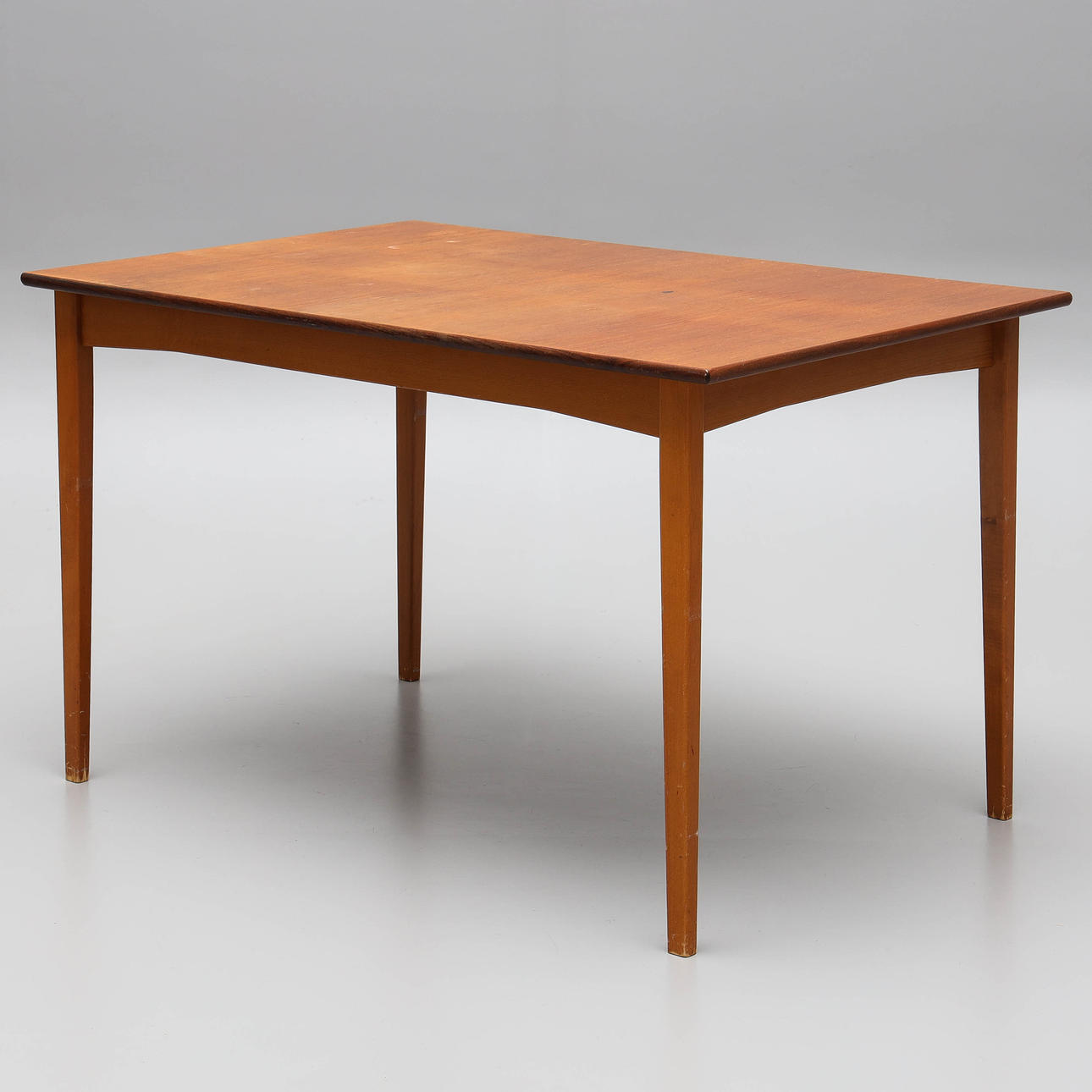 A 1950s/60s teak veneer dining table.