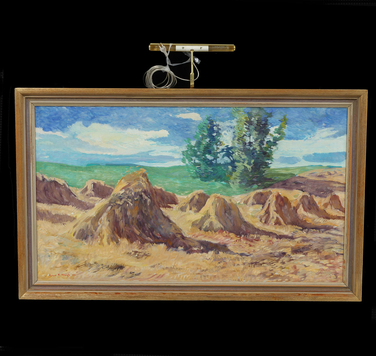 EINAR R KRAGH. Landskap med höbalar, olja på duk, signerad.