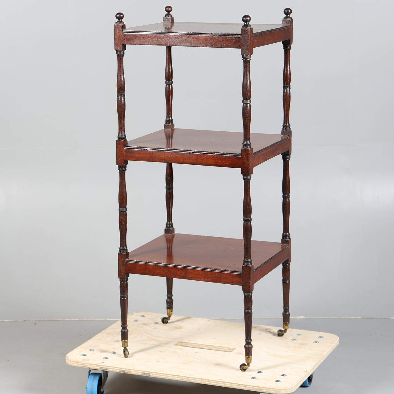 A VICTORIAN MAHOGANY WHATNOT.