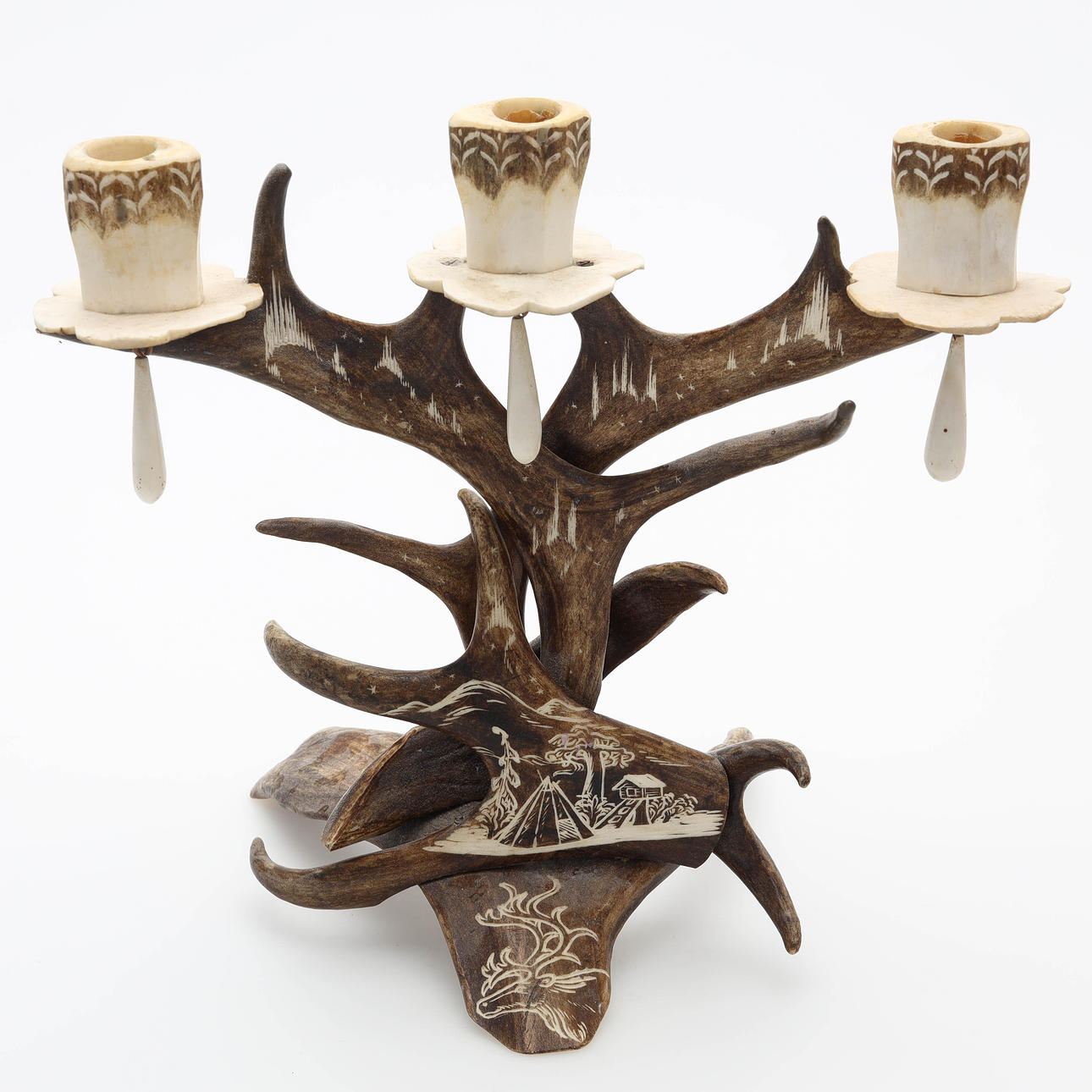 A candlestick, reindeer horn, samearwork.