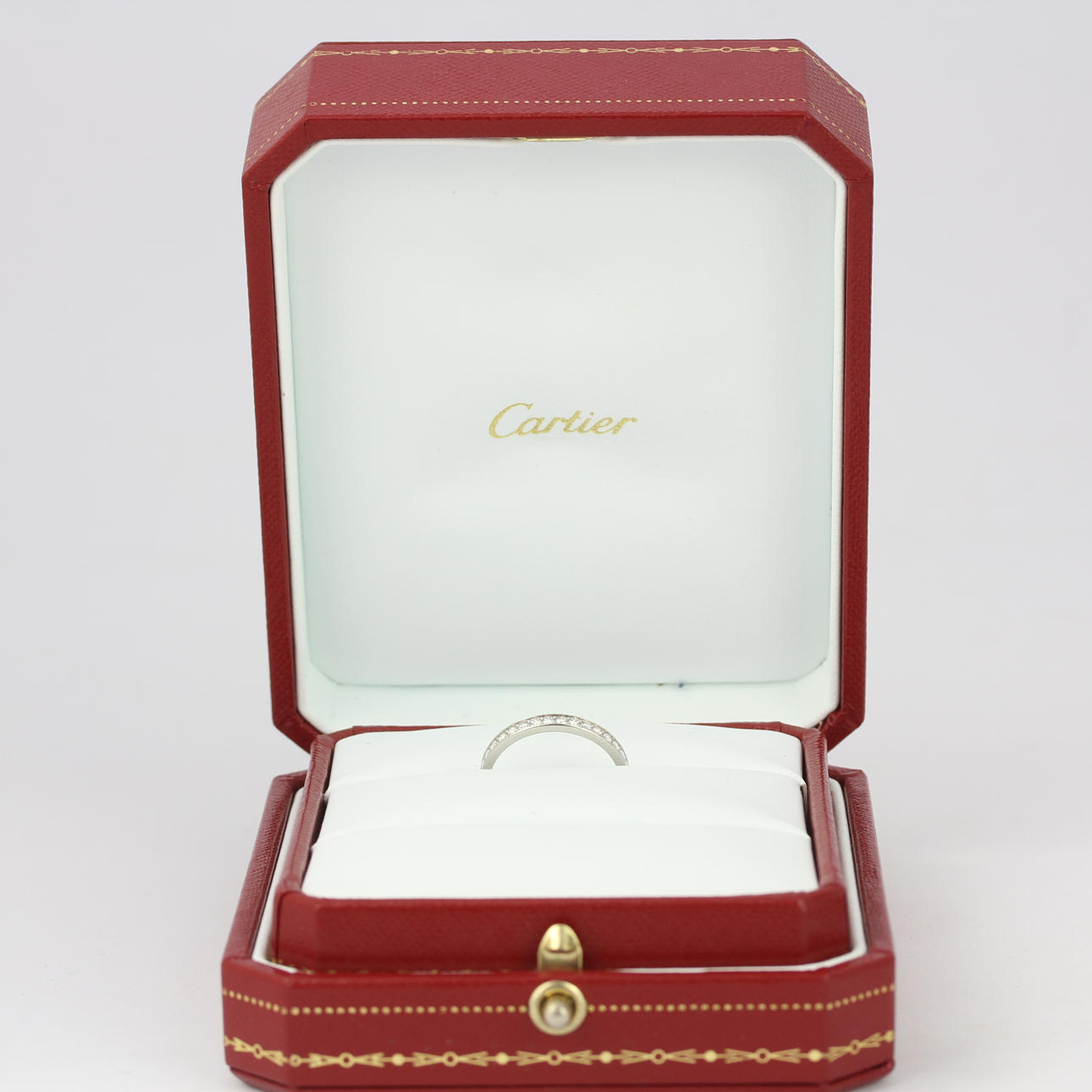 CARTIER PLATINUM DIAMOND SET HALF ETERNITY RING.