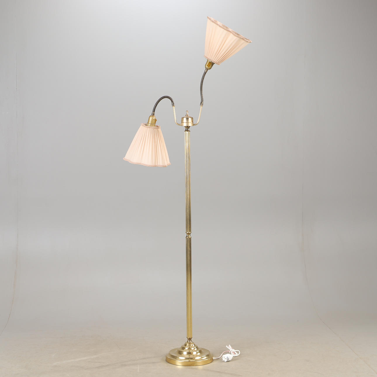 A brass floor lamp, mid 20th century.