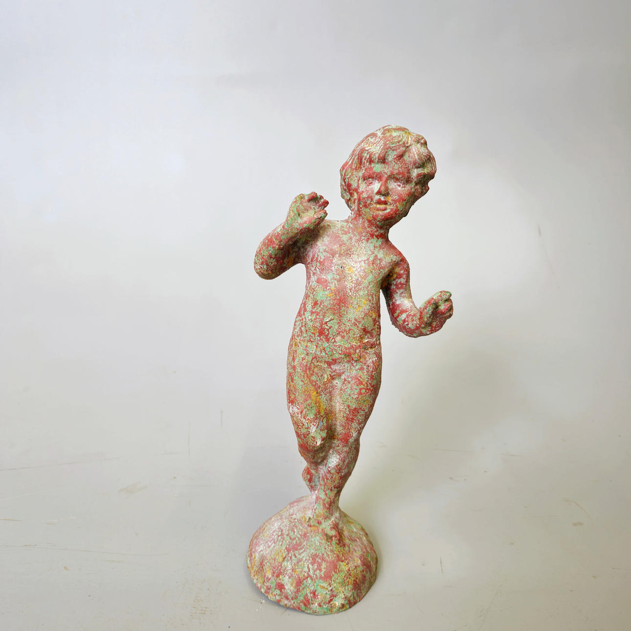 CHERUB. PATINATED CAST IRON.