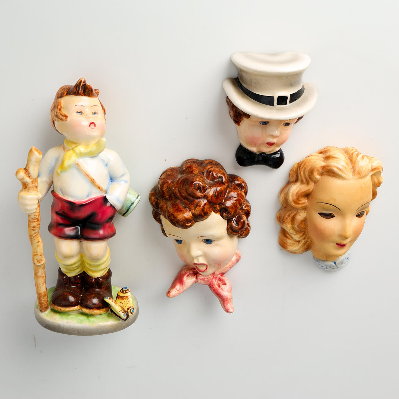 Goldscheider Vienna, four small earthenware figures (4).