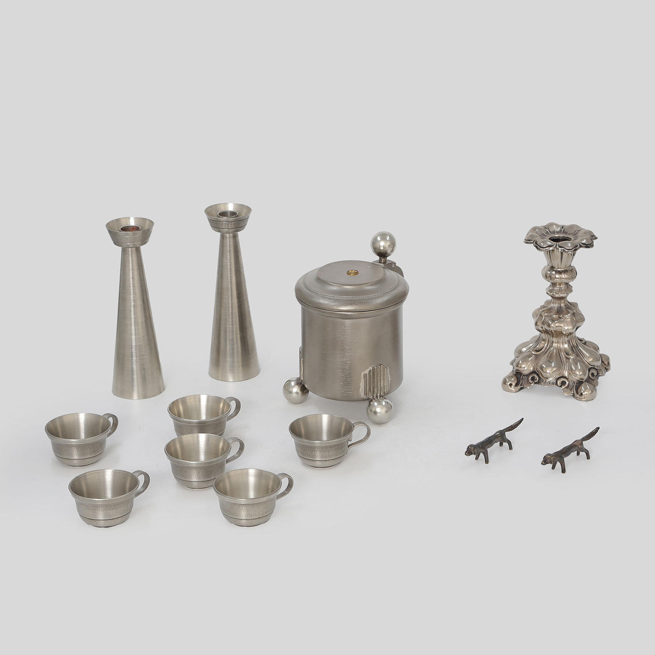 12 NICKEL SILVER AS WELL AS TIN OBJECTS, CANDLESTICKS, STOPS, ETC.