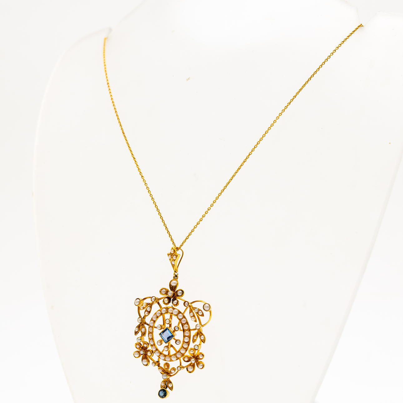 gold pendant with chain.