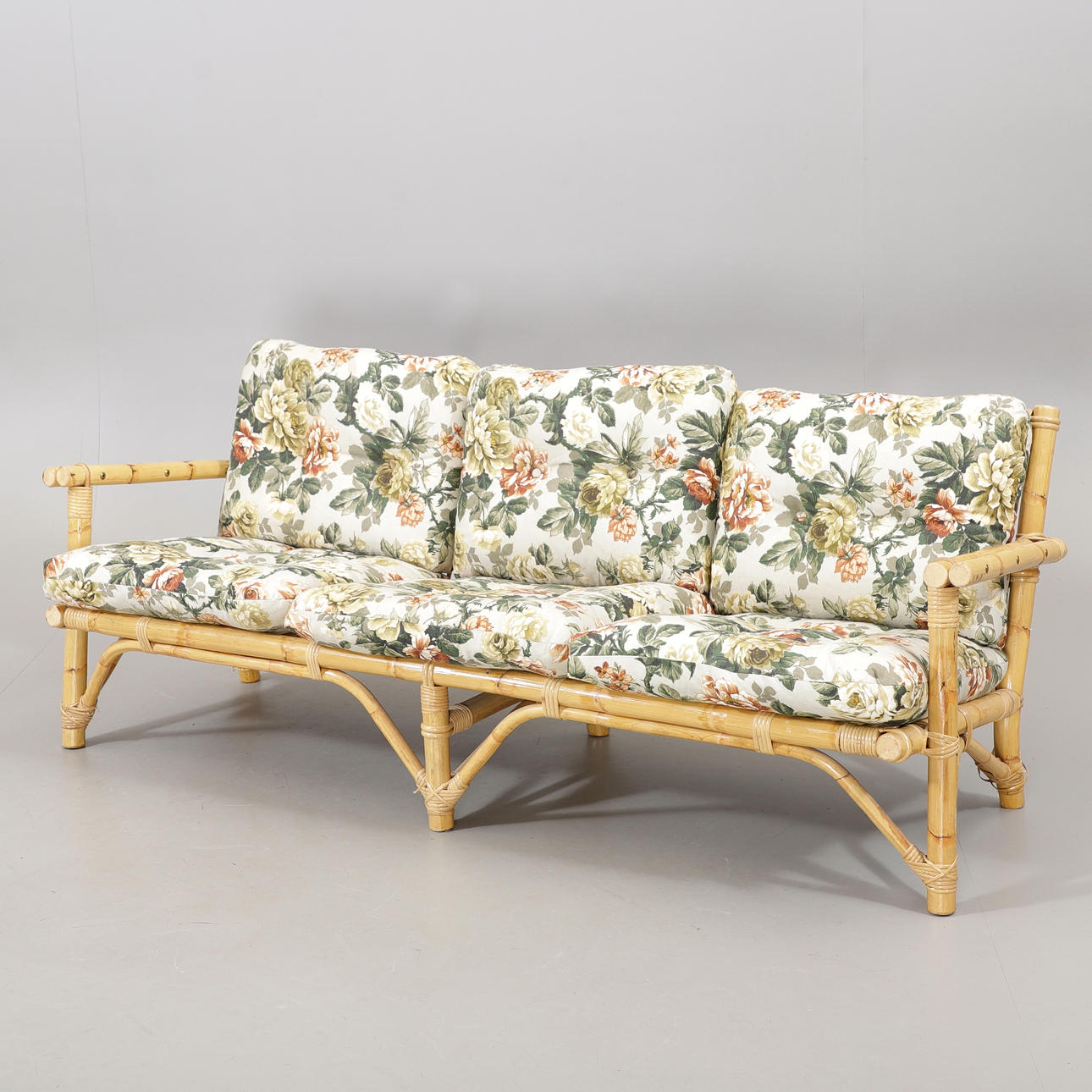 A 19th/21st century rattan sofa.