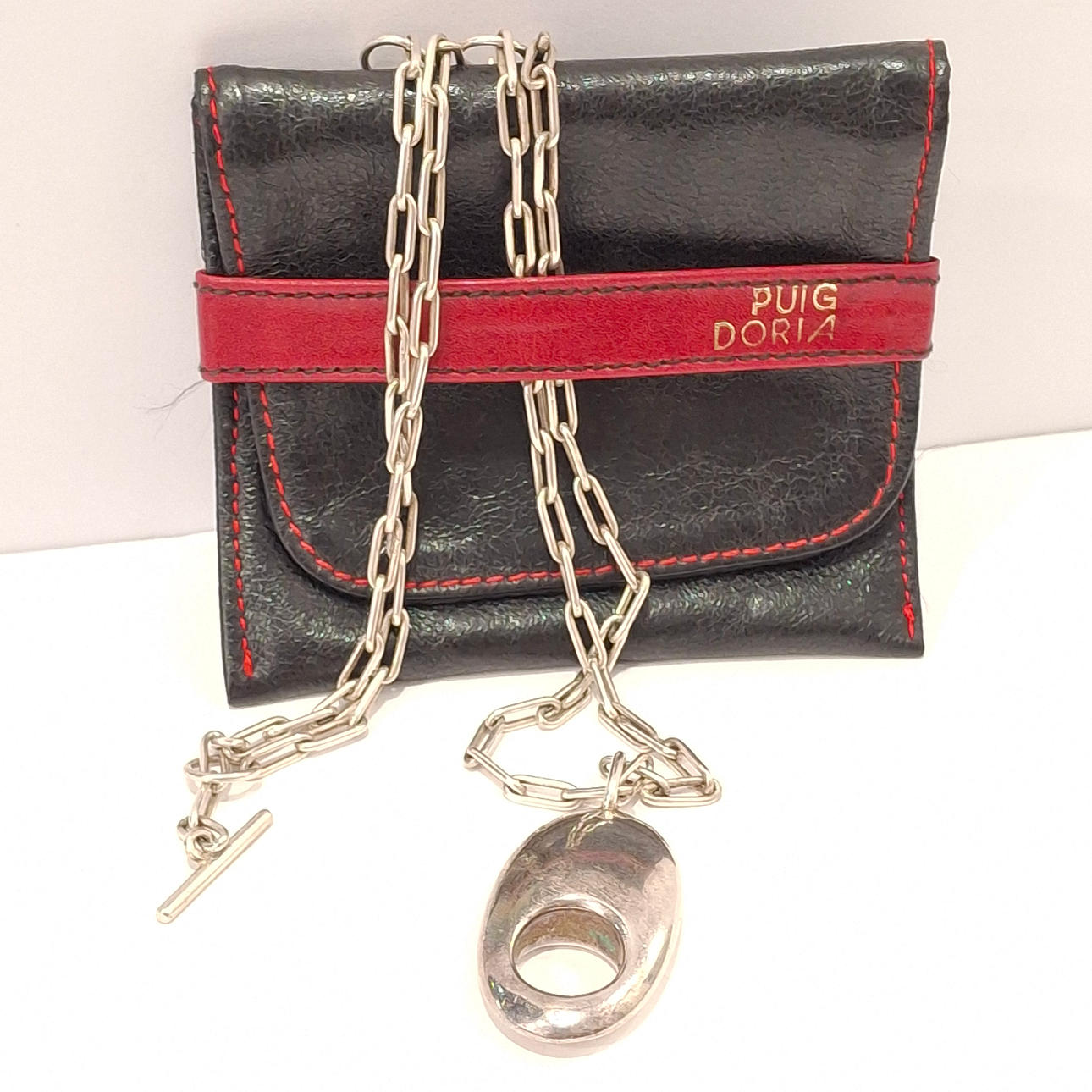 PUIG DORIA. Designer pendant with chain in silver. Punched. Adjustable chain.