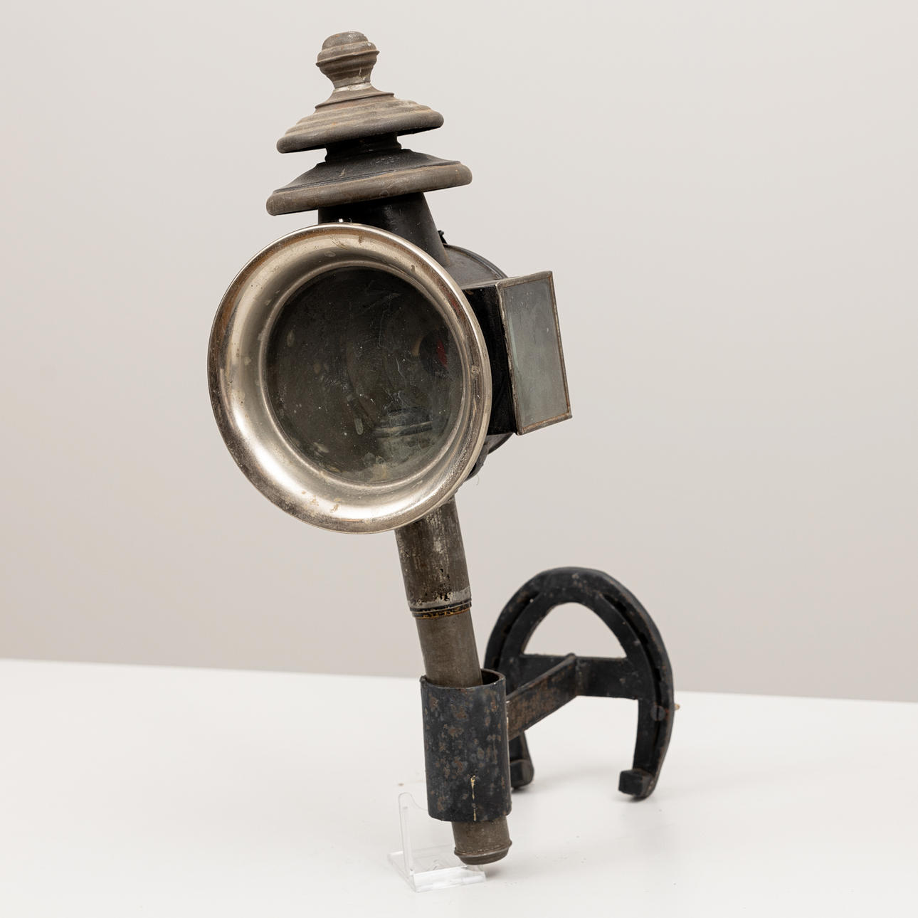 A carriage lamp, with a later wall mount, first half of the 20th century.