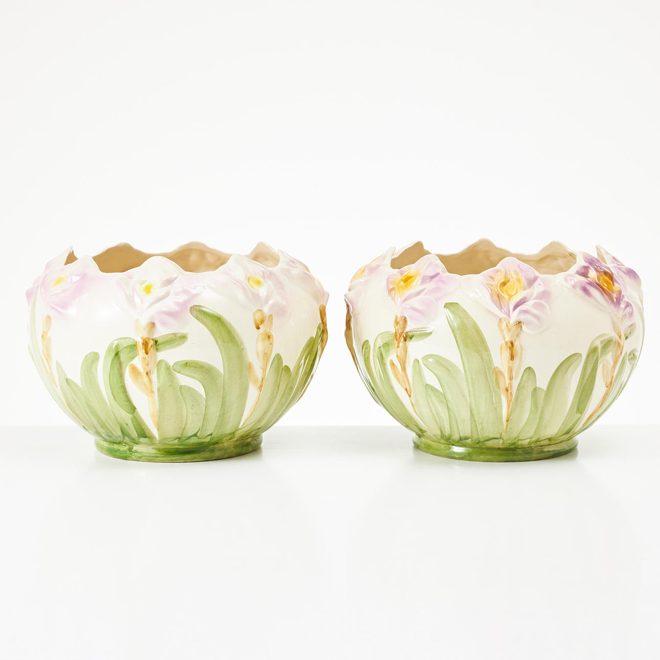 A pair of flintware outer linings, first half of the 20th century, Art Nouveau style, decorated with stylized flowers, polychrome painted.
