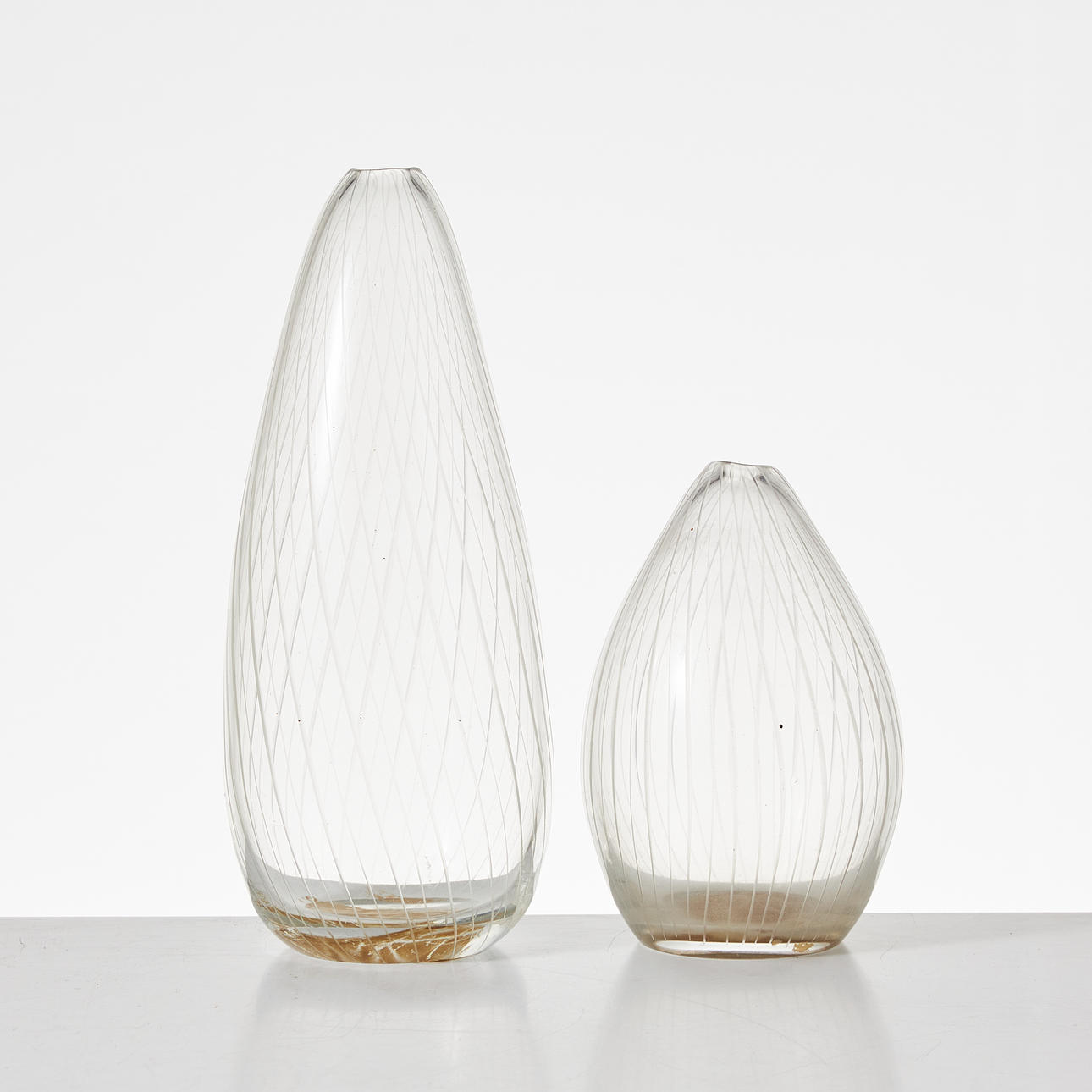 TAPIO WIRKKALA. Vases, 2 pieces Iittala, model 3282, chamfered, signed, one dated -57.