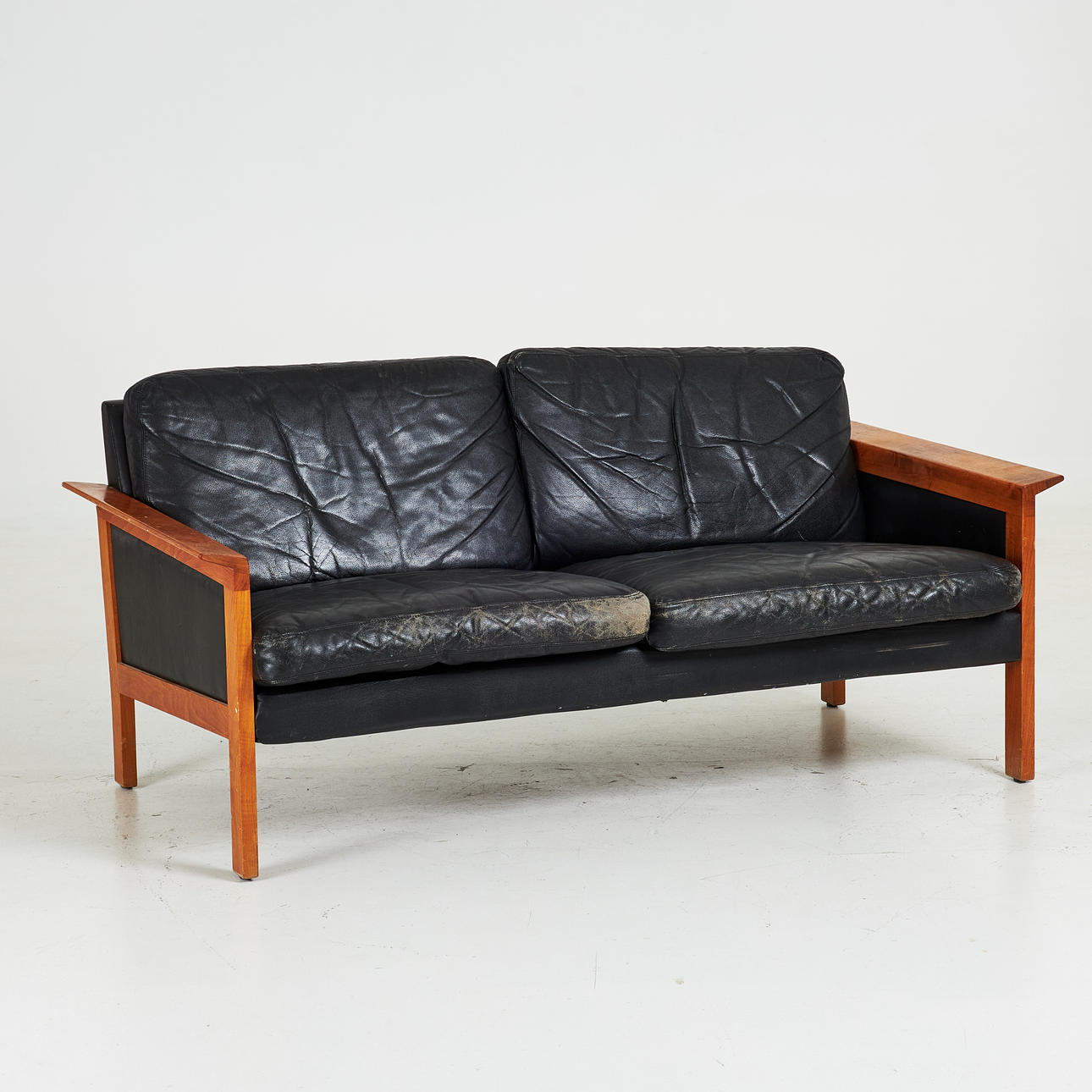GILLIS LUNDGREN. Sofa, “Skanör”, IKEA, 1960/70's, frame in teak, loose plush colours upholstered in black leather.