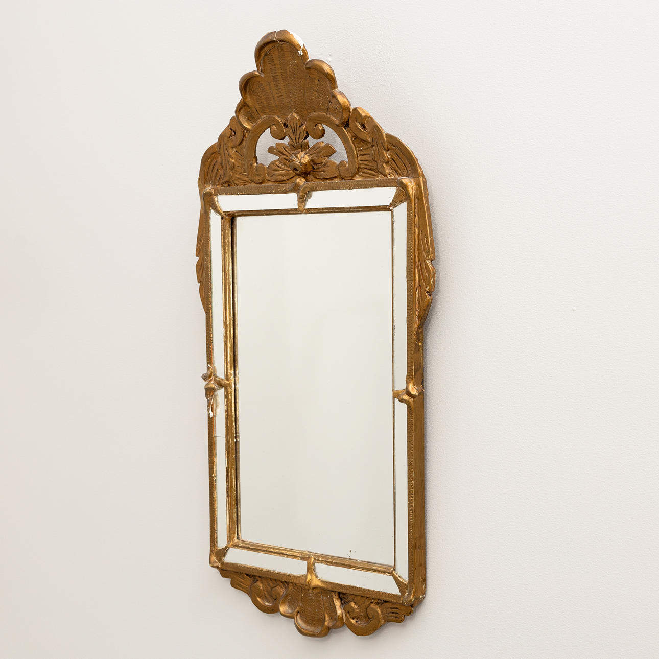 A rococo style mirror, early 20th century.