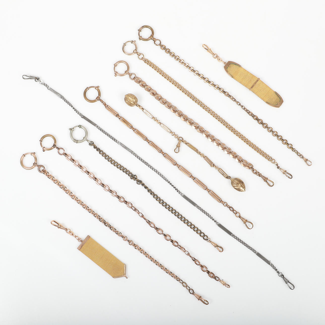 WATCH CHAINS AND CHATELAINE, 11 pieces, mostly gilt.