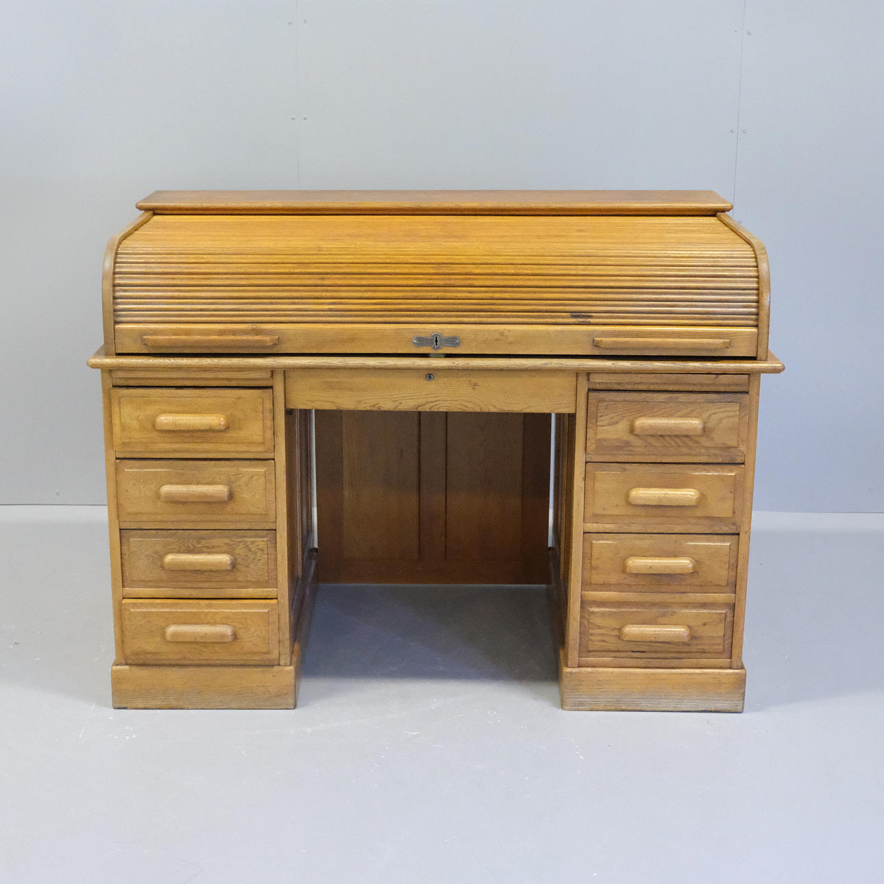 DESK WITH SHUTTERS, CIRCA 1900, OAK.
