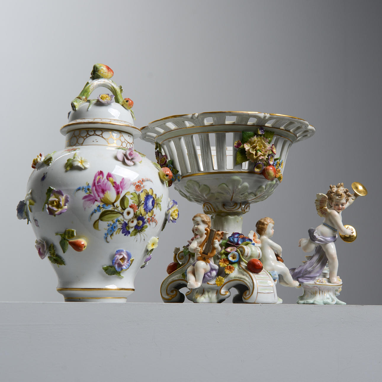 A set of 3 German lockurns and bowls, first part of the 20th century, including Meissen-like markings, Schierholz.