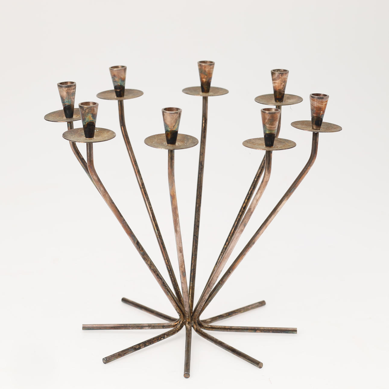 EINAR DRAGSTED, an 8-armed candlestick in silver stain, Danish silversmith, Denmark, mid 20th century.