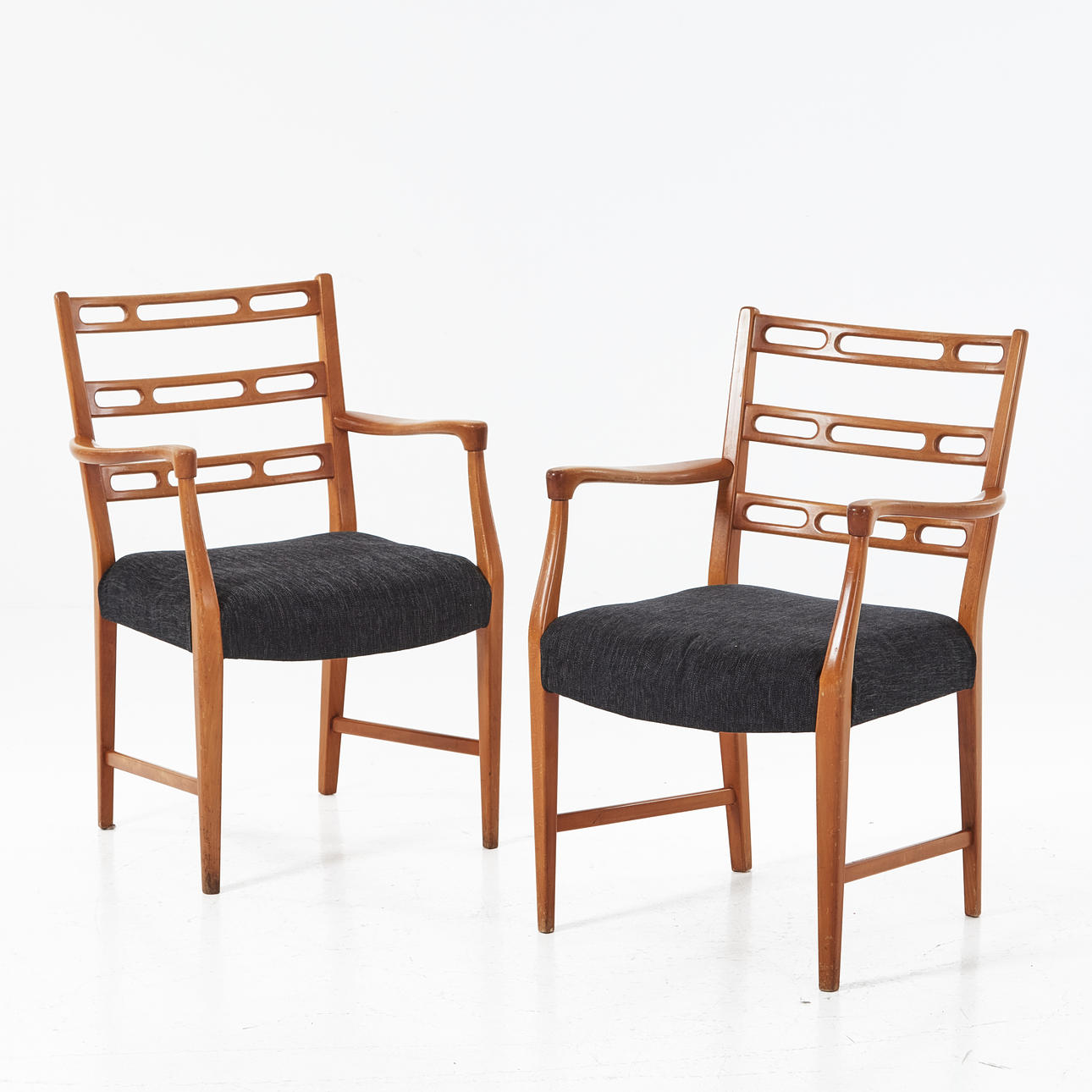 DAVID ROSEN. “Futura”, armchairs, a pair, stained beech, Nordiska Kompaniet, openwork back tray.