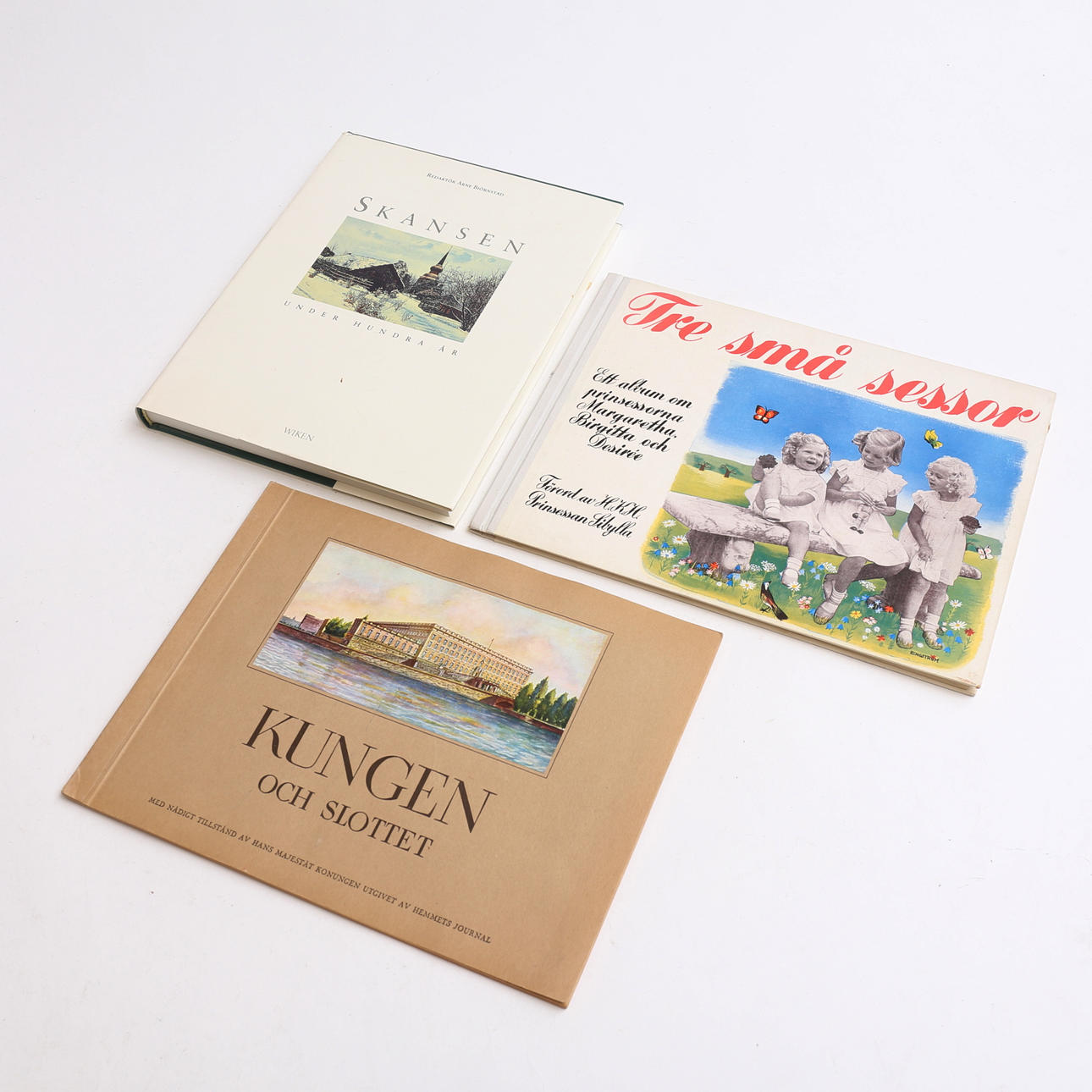 Three books, including “Three Little Sisters”.