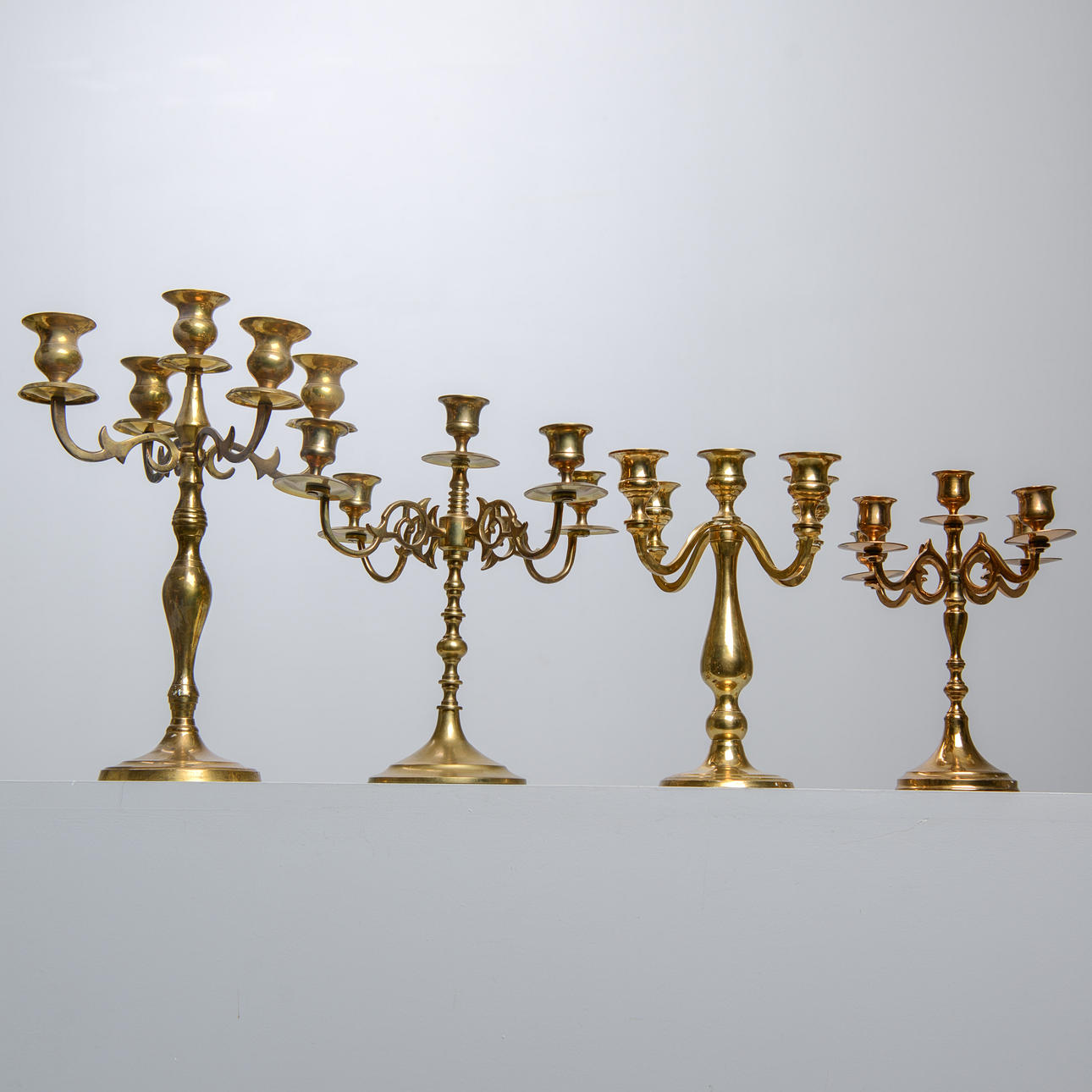 4 brass candelabra.