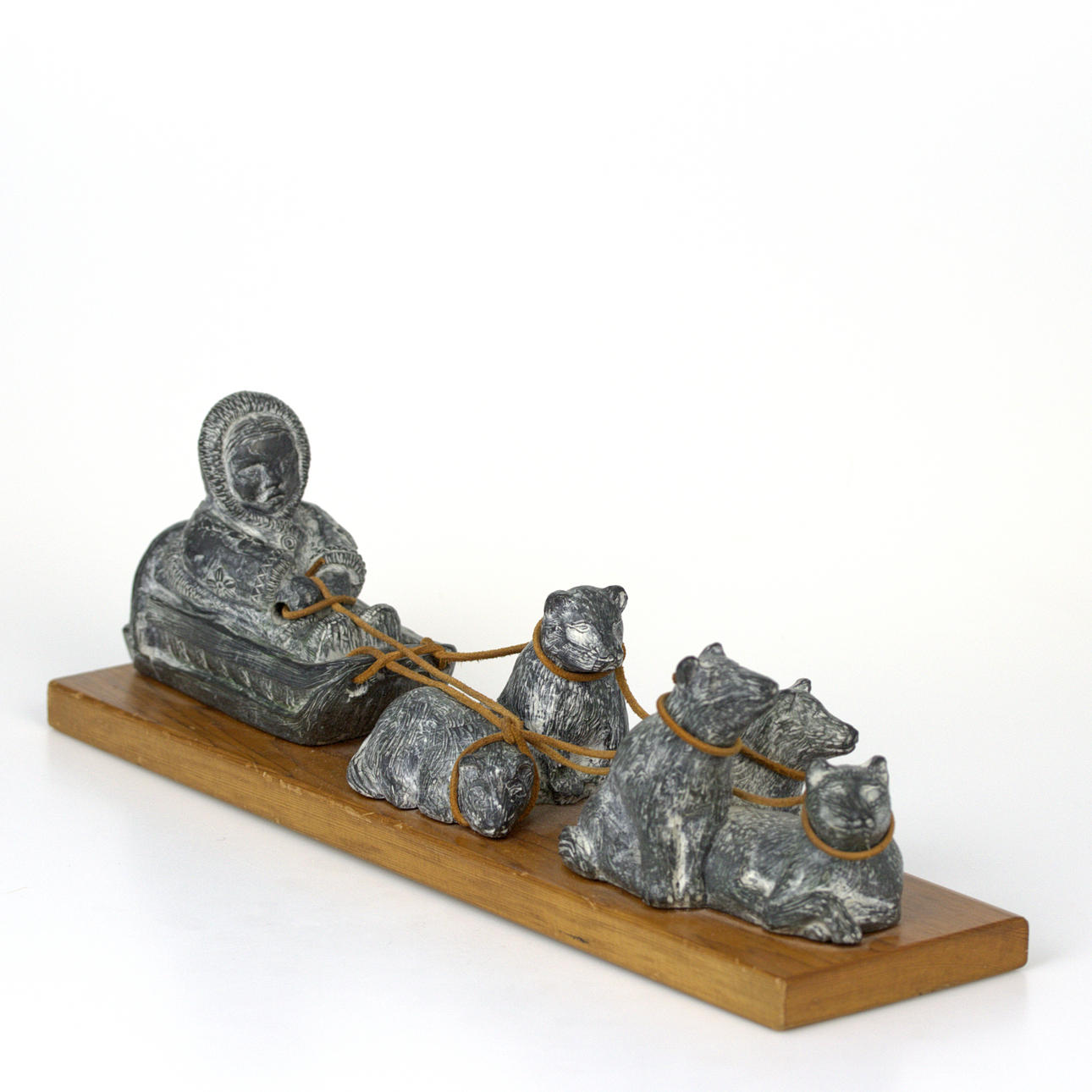 INUIT SCULPTURE, dog sled, handmade, soapstone on wooden plinth, The Wolf Sculptures, Canada.