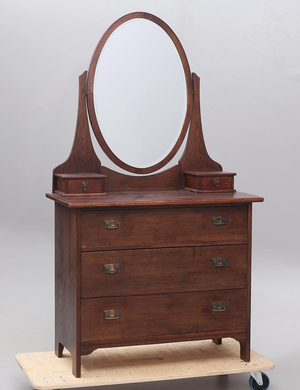 A stained oak mirror chest, 20th century.