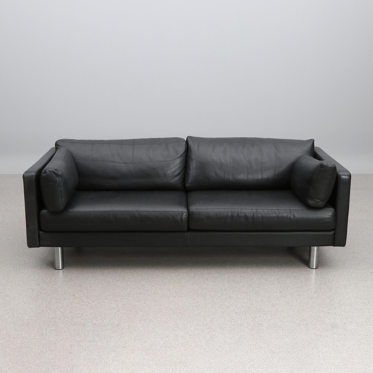 ERIK JØRGENSEN, SOFA. Black leather with chrome-plated legs.
