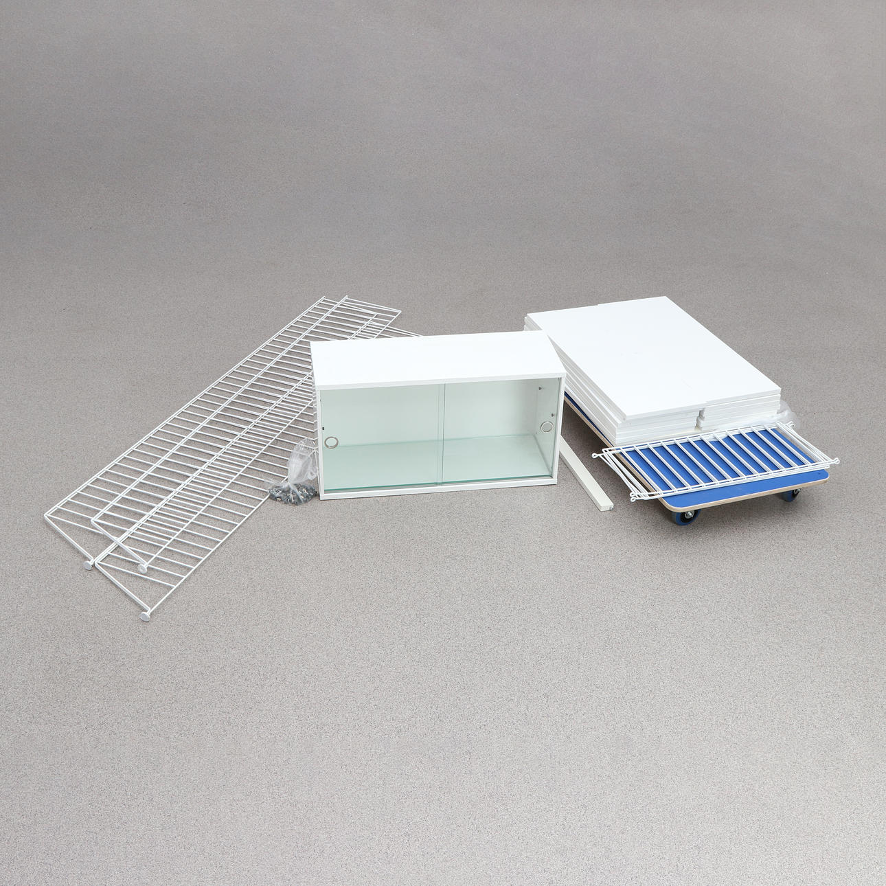 NILS STRINNING “STRING SHELF”. White lacquered metal and white laminate, late 20th/21st century.
