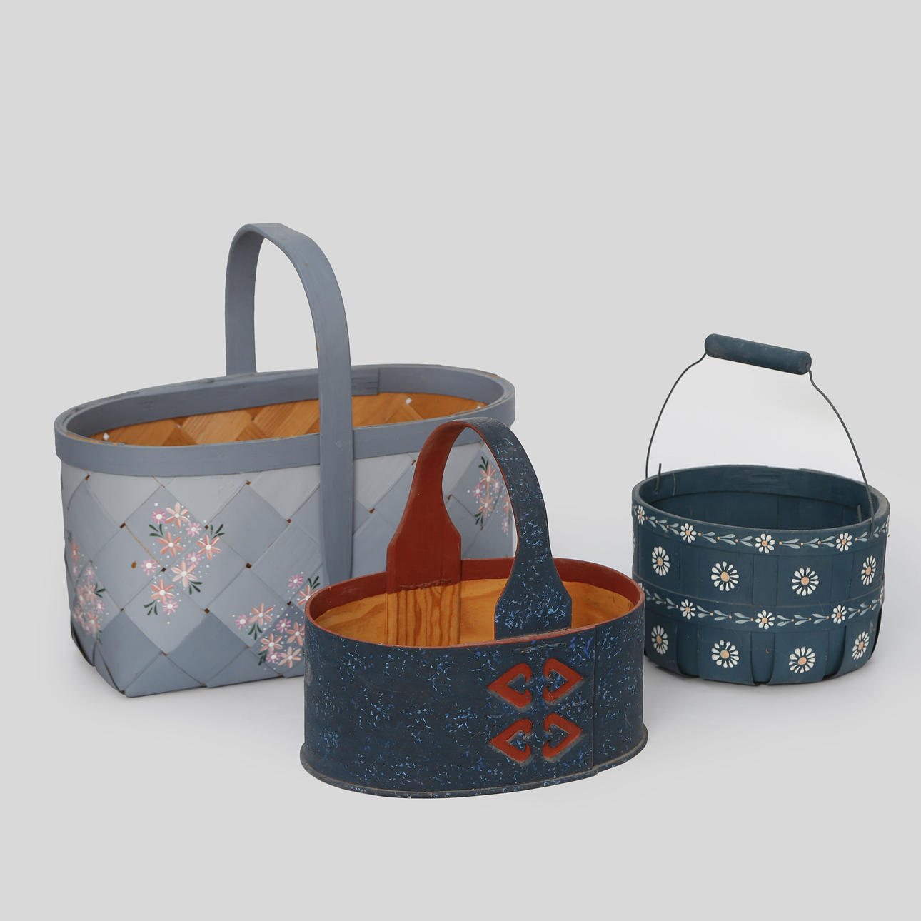 3 PAINTED CHIPBOARD BASKETS.