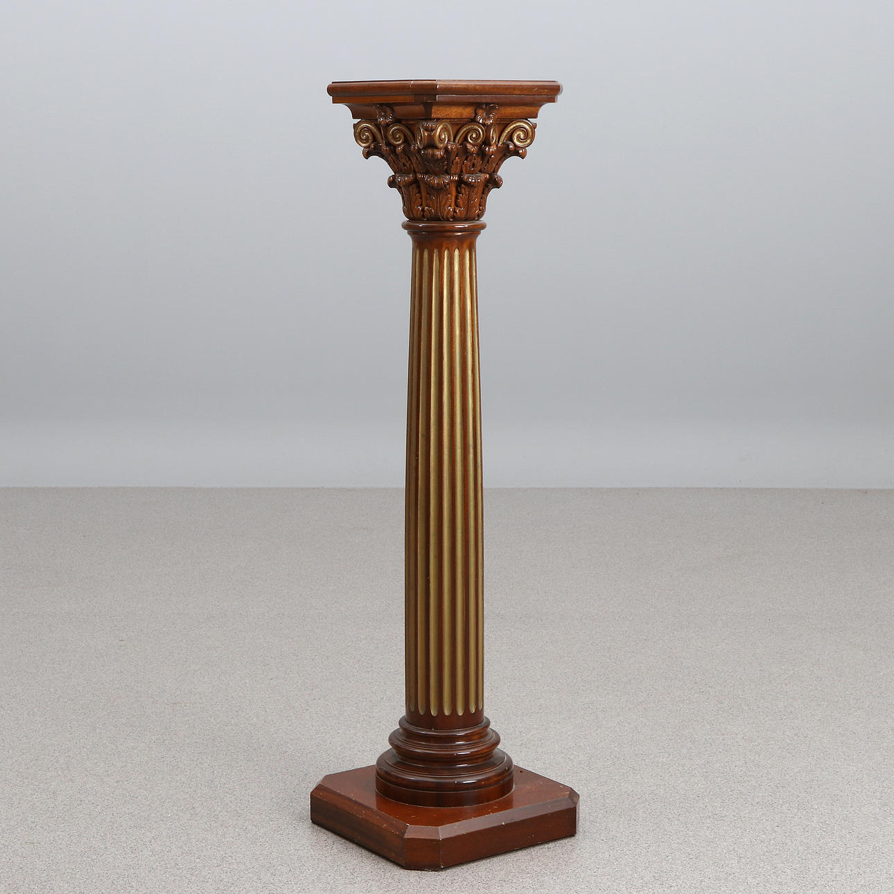 PEDESTAL. Mahogany with bronzing, in the form of a Corinthian column, 20th century.