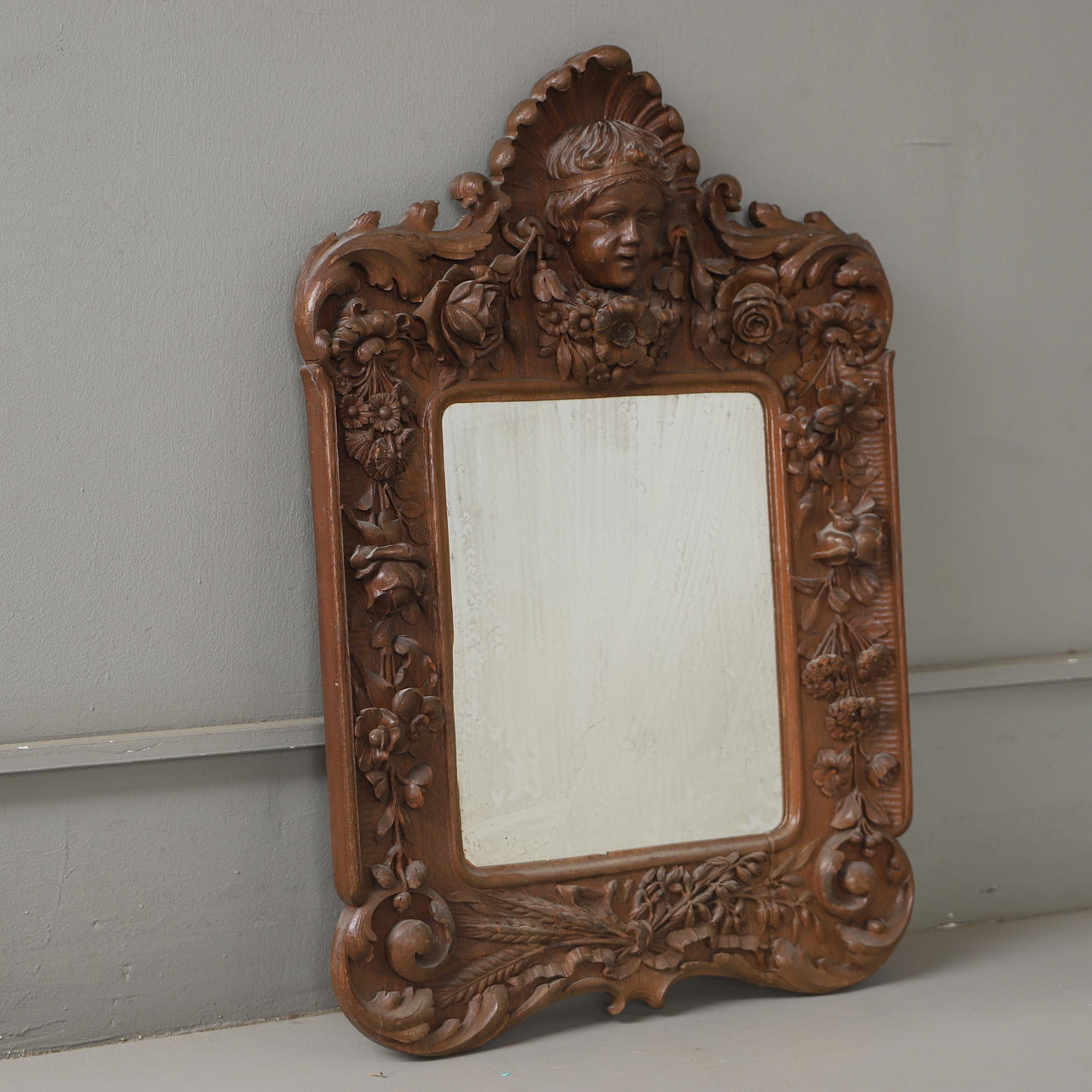 A mirror, richly cut oak, 20th century.