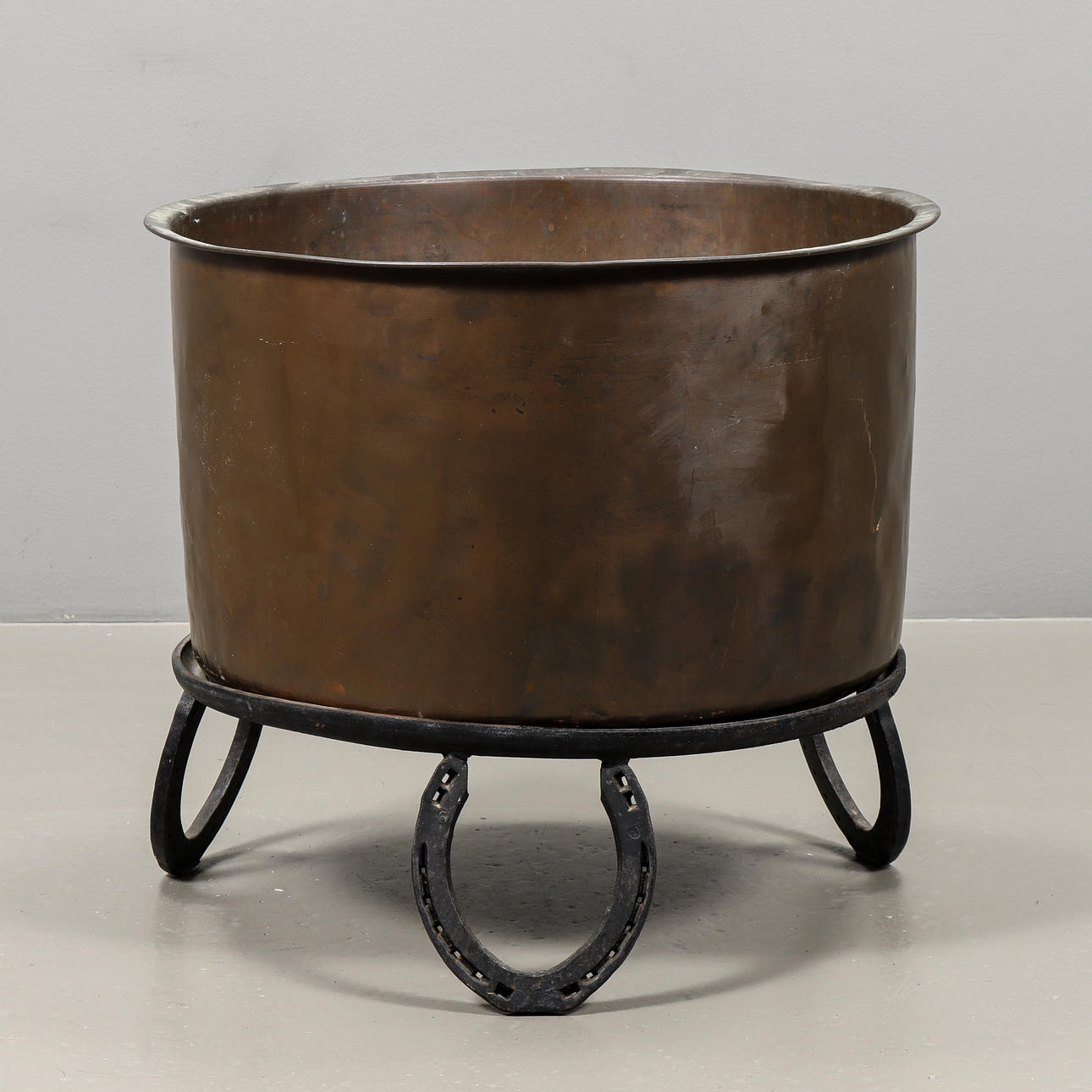 COPPER CAULDRON on forged stand.