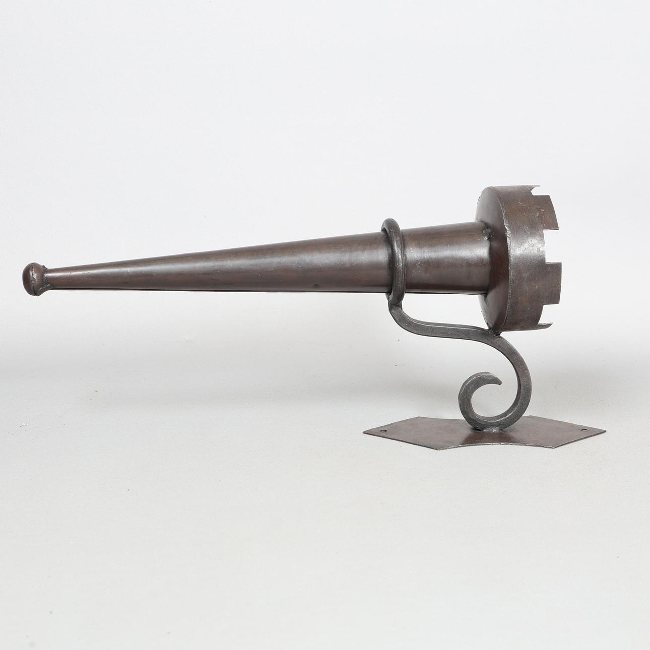 A CRENELLATED WALL SCONCE.