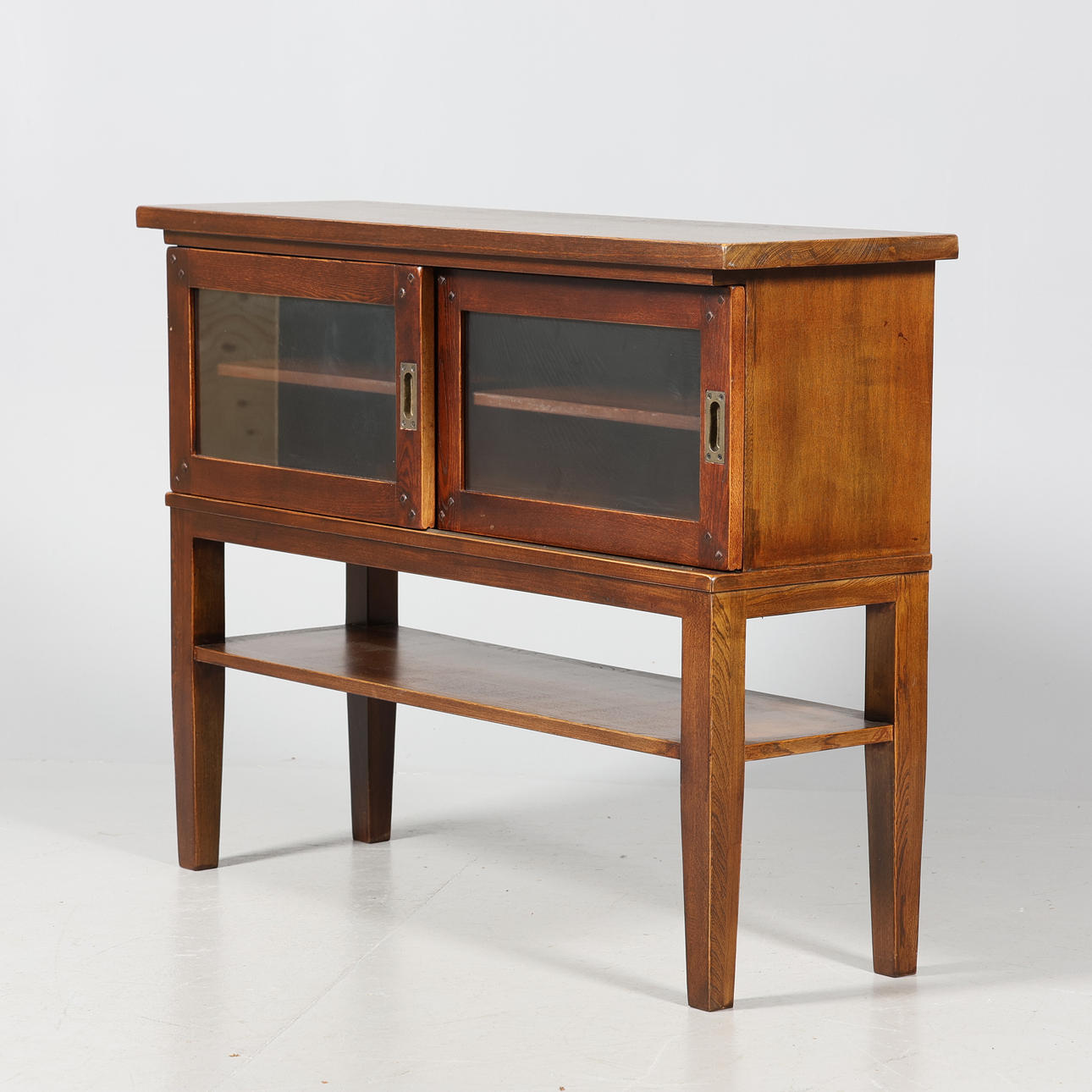 A sideboard with glass sliding door, second half of the 20th century.