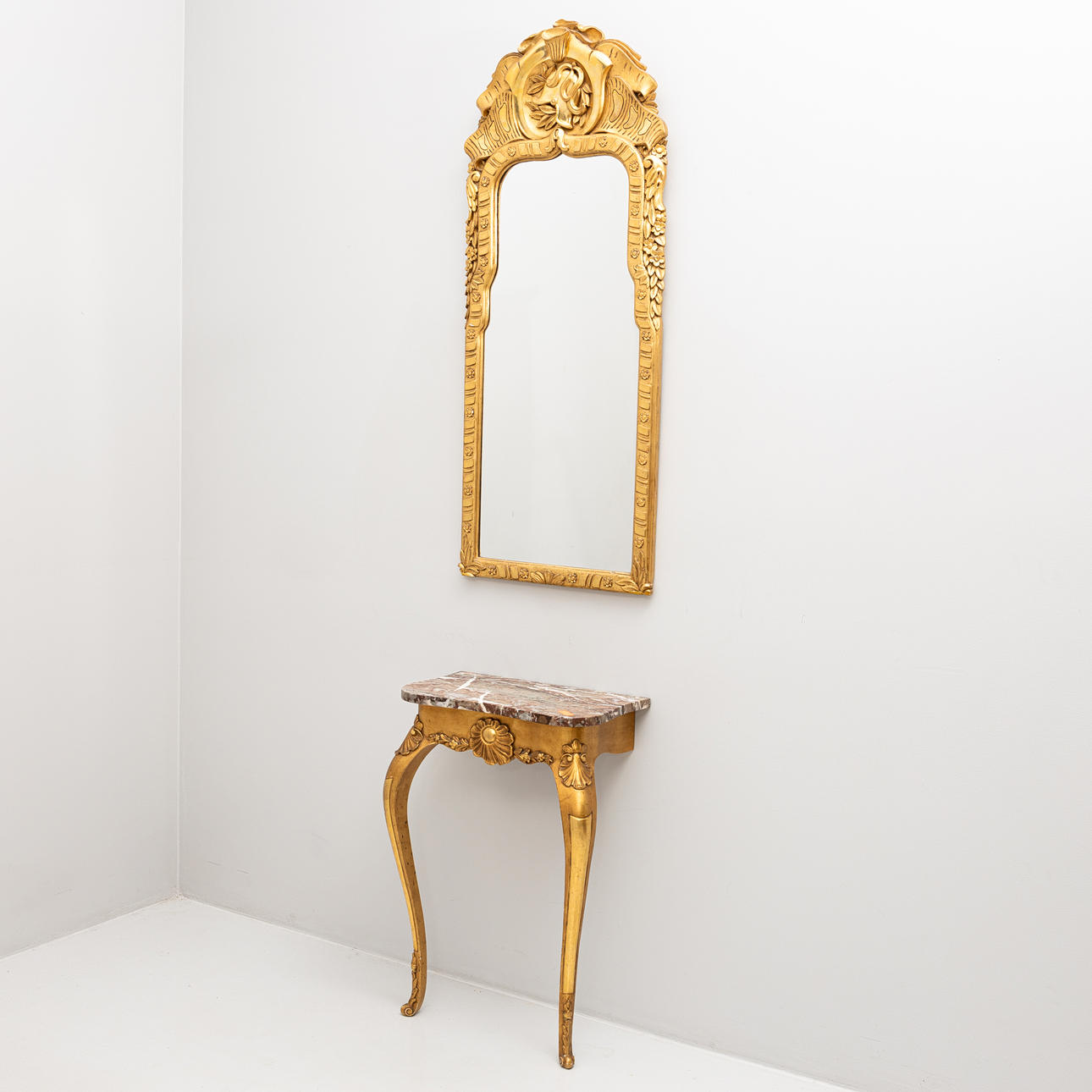 A rococo style mirror and console table, second half of the 20th century.