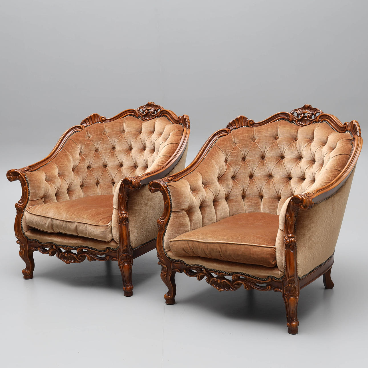 A pair of rococo style bergèrer, 20th century.