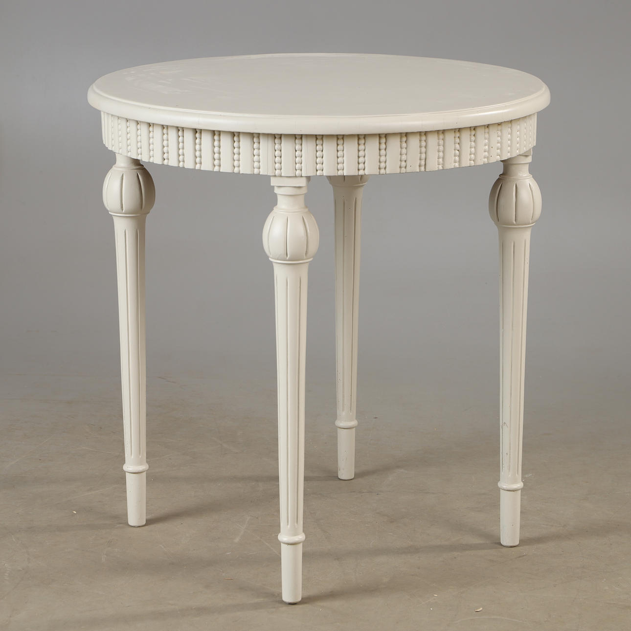 A side table, painted in grey, Gustavian style.