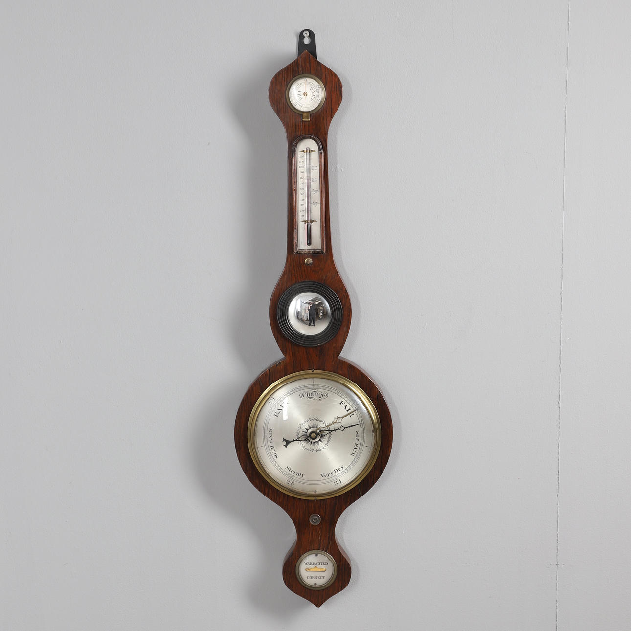 AN ANEROID BAROMETER IN CASE.