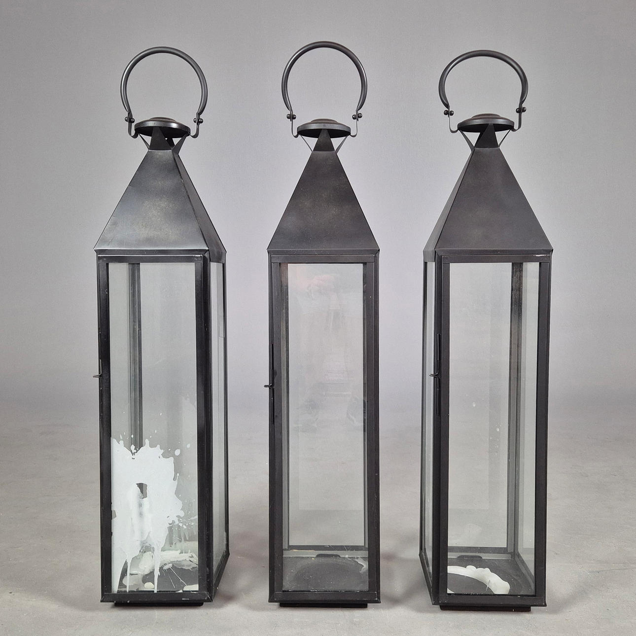 STORM LANTERNS, A SET OF 3.