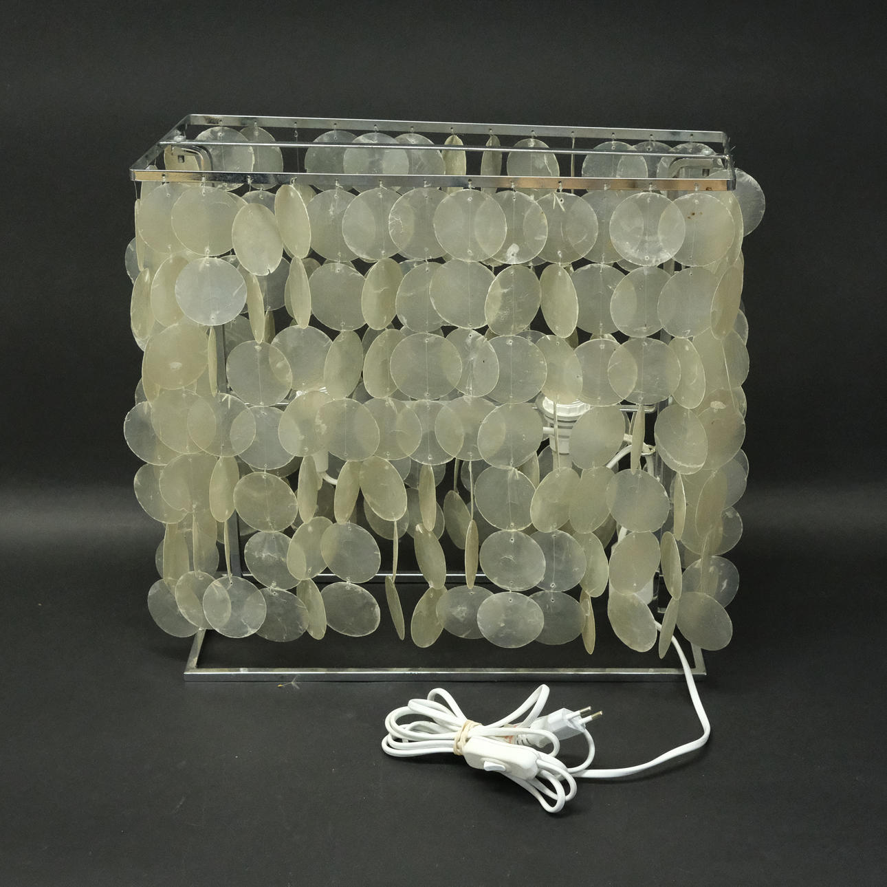TABLE LAMP, WITH STEEL FRAME AND SEASHELL.