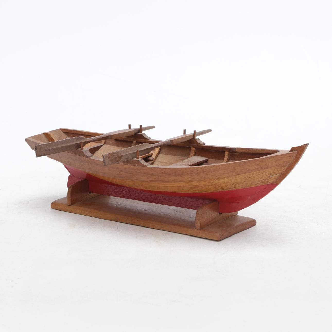 MODEL ROWING BOAT, wooden, in rack.