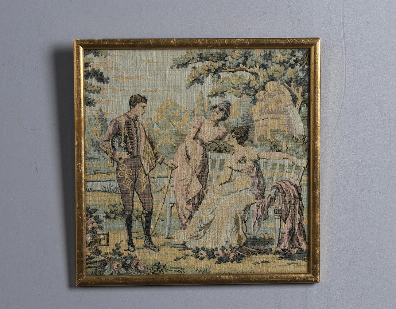 A 19TH-CENTURY FRAMED TAPESTRY.