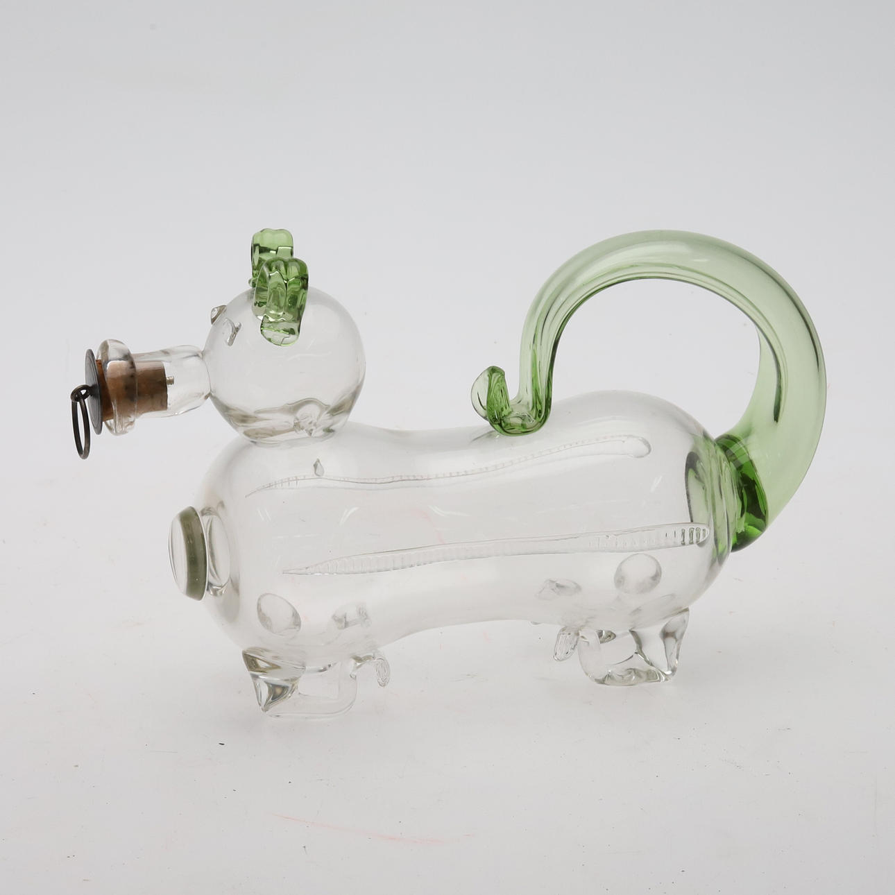 A glass decanter “drunk dog”.