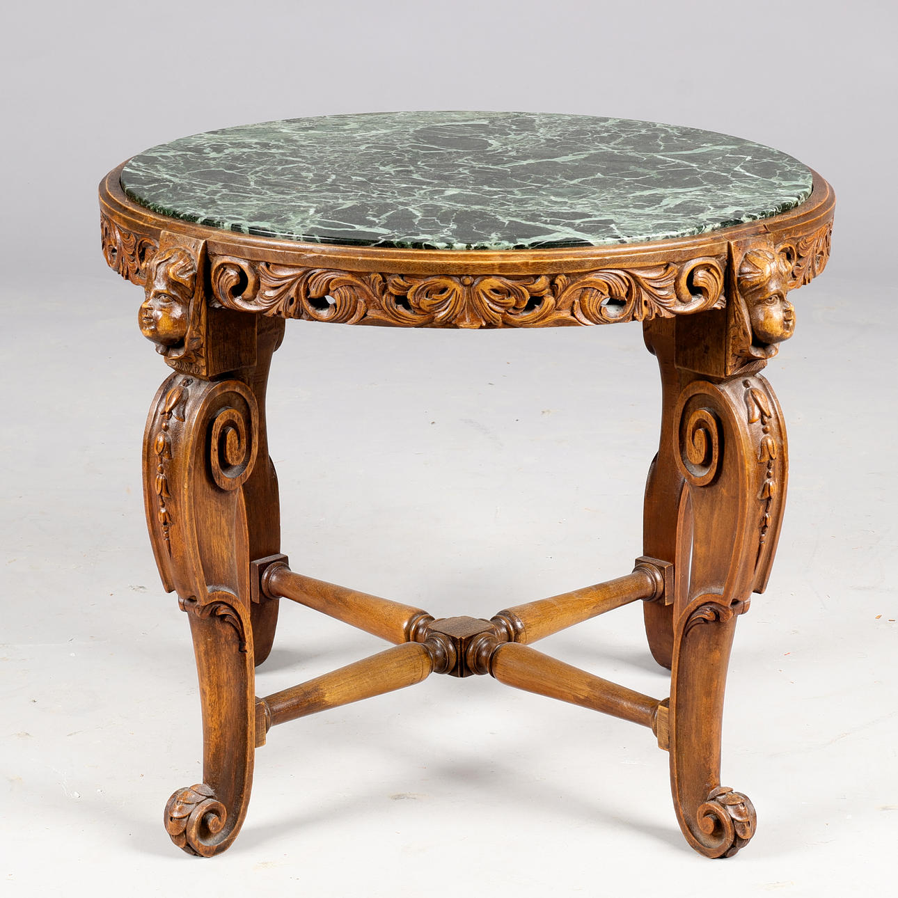 Round side table/lamp table made of carved walnut wood, 1920-30s.