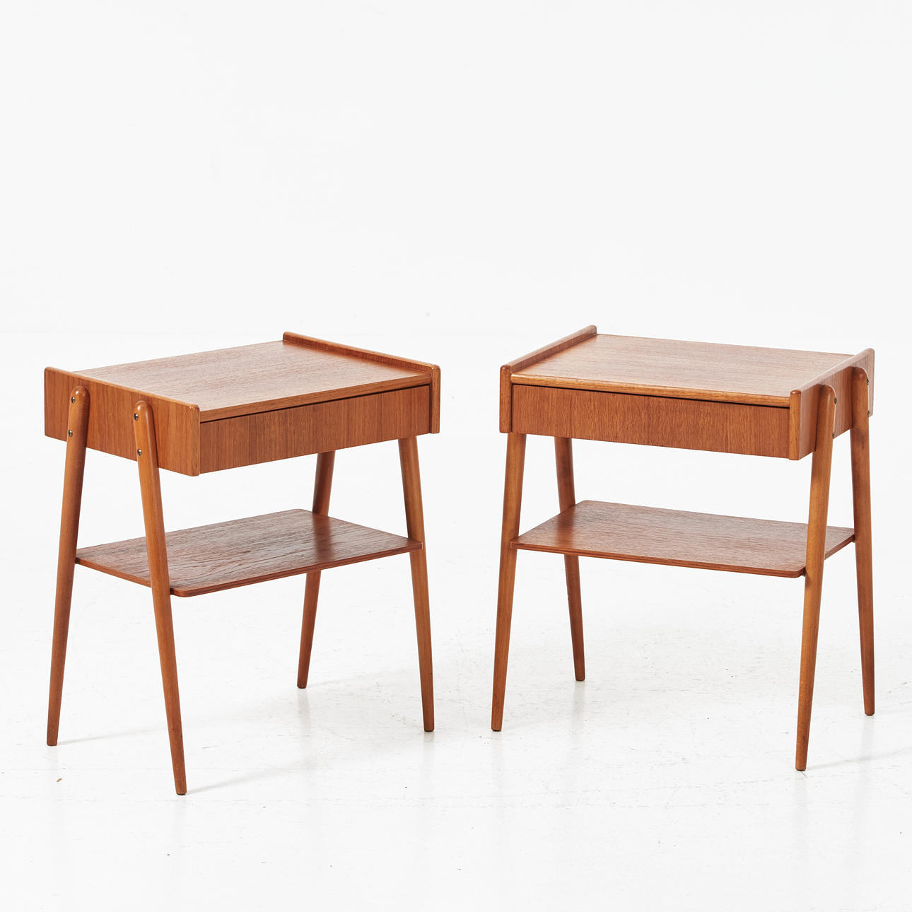 A pair of bedside tables, Carlström & Co furniture factory, 1950s, with labels.