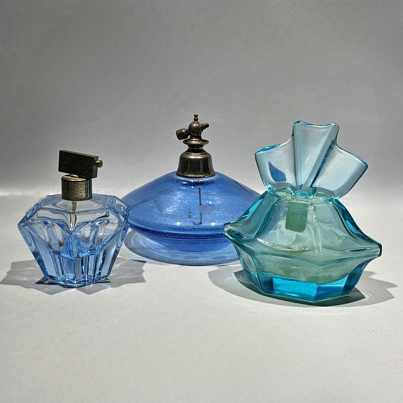 Collection of various perfumers in crystal and glass.
